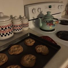 cookies are sitting on a cookie sheet in the kitchen