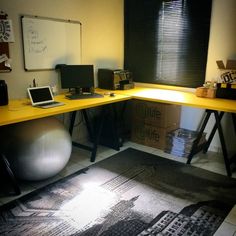 a desk with a laptop on top of it