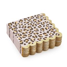 a stack of gold coins with a leopard print on it