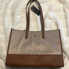 Brand New. Tan And Brown Color. Fit Laptop. Travel Personal Bag. Fashion. Trending. Great Price! Trendy Tommy Hilfiger Tan Bag, Elegant Tan Tommy Hilfiger Bag, Tommy Hilfiger Tan Bag For Daily Use, Tommy Hilfiger Tan Tote Bag, Tommy Hilfiger Bag, Tommy Hilfiger Bags, Laptop Bag, Brown Color, Tommy Hilfiger