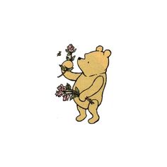 a winnie the pooh bear holding flowers