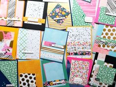 many different colored papers are stacked on top of each other with polka dots and stripes