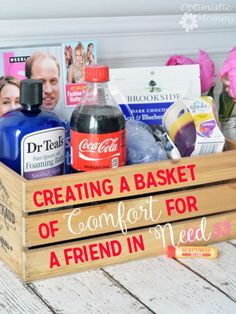 a wooden crate filled with lots of different types of items on top of a table