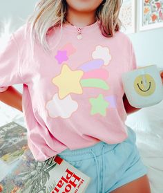 ⚝ Dreamy Pastel Shirt~ Awesome, stylish, simple. This goes well with jeans, shorts, or tuck into pants to complete your cool & urban, and comfy look! ⚝  ✨Don't see your favorite color? Shoot us over a message and we'll look into all the options!✨ 💟Product Details: ❥Handmade design ❥Breathable Comfort. ❥ True to size (UNISEX fit) ❥ Fabric: 100% Cotton (crewneck, lightweight and breathable, soft and comfortable ) ❥Care Instruction: Machine wash cold with similar colors, do not bleach, tumble dry Trendy Summer T-shirt With Star Patch, Cute Short Sleeve T-shirt With Star Print, Trendy Star Patch Tops For Spring, Trendy Spring Tops With Star Patch, Trendy Tops With Star Patch For Spring, Trendy Cotton Tops With Cute Design, Pink Star Print Crew Neck T-shirt, Pink Crew Neck Top With Star Print, Cute Pastel Crew Neck Tops