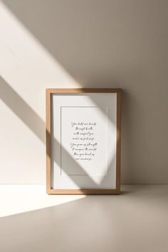 a framed photograph with a quote on it