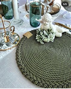 a place setting with plates, cups and vases