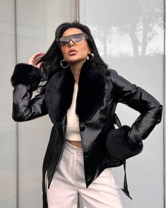 Introducing the Classy Diva Faux Fur Coat: a luxurious piece that exudes modern elegance. Crafted from patterned fux leather and trimmed with a faux fur collar and sleeves, this timeless crop jacket is finished with rounded front buttons, a belted waist, and side pockets for added warmth. A must-have for any sophisticated wardrobe. Fits True To Size For Most Model Wearing A Small Sophisticated Wardrobe, Black Faux Fur Coat, Europe Outfits, Classy Fashion, Faux Fur Collar, Faux Fur Coat, Fur Collar, Fur Collars, Crop Jacket