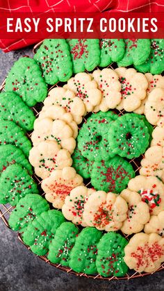 an easy spritz cookies wreath is displayed on a plate with red and green sprinkles