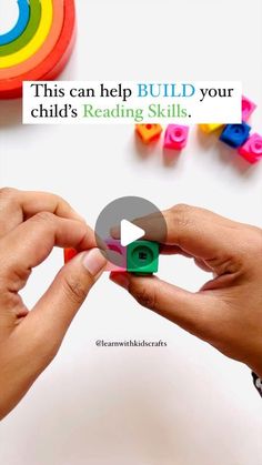 two hands are holding small blocks with the words build your child's reading skills