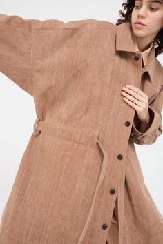 Woven Cotton Long Coat in Brown - Oroboro Linen Single Breasted Outerwear With Spread Collar, Single Breasted Linen Outerwear With Spread Collar, Linen Single-breasted Outerwear With Spread Collar, Spring Linen Outerwear With Spread Collar, Linen Outerwear With Spread Collar And Buttons, Belted Beige Cotton Outerwear, Belted Linen Long Sleeve Outerwear, Belted Linen Outerwear For Fall, Fall Linen Belted Outerwear