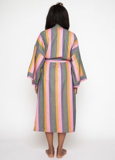 Take your tub time up a notch with our super soft, richly hued, 100% super soft cotton long robe in Palma, a lush green paired with sunny brights and deep water blue. Ethically handwoven on looms in India, the robe packs a punch with stripes that stand out. Complete your look with the matching scrunchie. Trust us, you'll never want to get dressed again. Product Details: 100% cotton Striped pattern featuring green, light pink, orange and blue Unisex, one size: 51" length, 28" shoulder (across bac Multicolor Summer Robe For Home Use, Multicolor Spring Loungewear Robe, Summer Long Sleeve Multicolor Robe, Stripe Robe, Multicolor Long Cotton Robe, Sleepwear Robe, A Perfect Circle, Hair Wraps, Size 16 Dresses