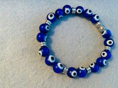 Beaded blue stretch bracelet with evil eye beads (8 mm)!handmade jewelry! All items can be customized for personal preference or size, just message me upon placing order! Pumpkin Candy Corn, Pumpkin Bead, Evil Eye Beads, Halloween Beads, Fun Bracelet, Eye Beads, Halloween Spider, Eye Bracelet, Evil Eye Bracelet