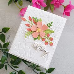 a close up of a greeting card with flowers