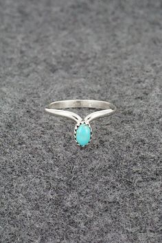 This simple yet elegant turquoise and sterling silver ring was made by Navajo silversmith Hiram Largo. The inside of the band is stamped sterling. (Please note: the stone color may vary slightly from the photos.)Size: 9.5Stone Length: 1/4"Stone Width: 3/16"Free shipping on all orders! We ship with USPS and always include tracking. All orders ship within a day of payment.Returns are accepted up to 30 days after you receive your order. Just send us a message. Our shop offers cash back or store credit. The item must be returned in new condition. Silversmith Rings, The Stone, Skull Art, Turquoise Sterling Silver, Sterling Silver Ring, Stone Color, Silver Ring, Sterling Silver Rings, Dream Wedding