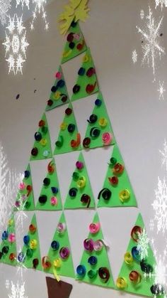 a christmas tree made out of paper and buttons