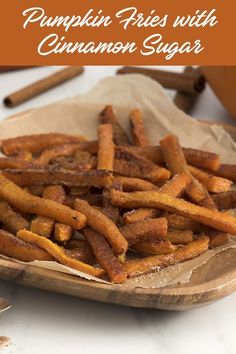 pumpkin fries with cinnamon sugar on a wooden plate