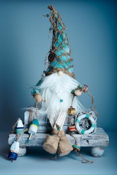 a stuffed animal sitting on top of a wooden bench next to bottles and other items