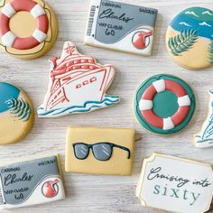 decorated cookies are arranged on a table with the names of different places and things in them