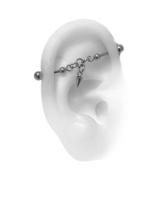 an ear with a chain attached to it and two piercings on the middle one