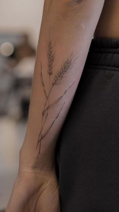 a person with a tattoo on their arm