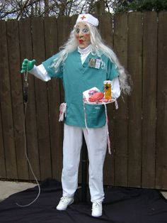 a person dressed as a nurse holding a tray with food on it and an oxygen tube in his hand