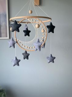 a mobile with stars hanging from it's sides