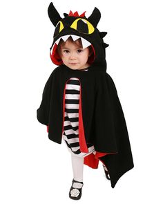 a small child dressed in a costume