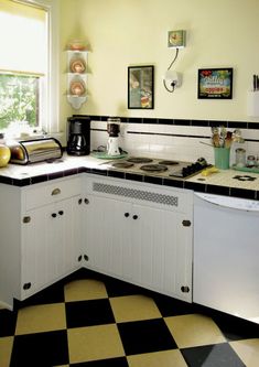 a black and white checkered floor in a kitchen