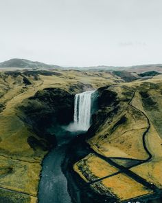 an aerial view of a waterfall in iceland