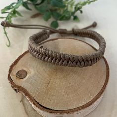 Boho style bracelet, made of waxed cord, perfect for wear on your weekends on the beach!  Embrace the beauty of simplicity with our Wax Cord Bracelet. The natural and organic look of the waxed cord gives this bracelet a rustic charm, allowing you to effortlessly incorporate it into your everyday style. It's a piece that resonates with the simplicity of nature. Perfect gift for your surfer friends. ♥ ITEM DETAILS: Total length: The size of the bracelet is adjustable. The bracelet for women closes approximately 6", and the bracelet for men has an adjustable closure that will fit a 7" wrist. Materials: Waxed cord.  Waxed Cord Available: Light Brown with Dark Brown  Waxed Cord Size: 1.5mm waxed cord  ♥ GIFT IT Jewelry comes in a cute bag ready to gift! If you wish your item to be a gift, pleas Handmade Brown Bracelets For Friendship, Handmade Brown Braided Bracelets For Friendship, Handmade Brown Braided Friendship Bracelets, Friendship Hand Wrapped Waxed Cord Bracelets, Handmade Earthy Leather Bracelet With Adjustable Fit, Rustic Adjustable Hand-wrapped Bracelet, Rustic Adjustable Hand Wrapped Bracelet, Rustic Adjustable Wrap Bracelet, Casual Brown Leather Bracelet For Festivals