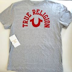 New With Tags Logo Horse Shoe Tee By True Religion Us Sizing Crew Neck Short Sleeve Print True Religion Graphic Design T-Shirt Square Bottom Hem See Other Designs And Colors. Light Grey And Red Logo Bundle For Discounts. Buy With Confidence. Fast Shipping! Basic Tan Tops With Graphic Print, Relaxed Fit Tan Top With Logo Print, Tan Graphic Tee Shirt With Crew Neck, Tan Graphic Tee With Crew Neck, Tan Graphic Tee Shirt With Logo Print, Red Short Sleeve Tops With Branding, Tan Short Sleeve Top With Logo Print, Casual Red Shirt With Branding, Tan Crew Neck Shirt With Logo Print