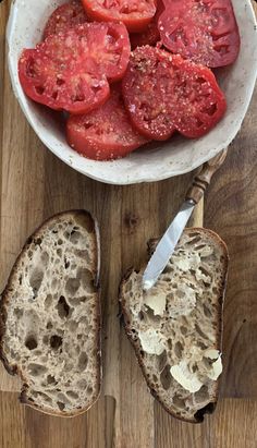 sliced tomatoes and bread on a wooden table