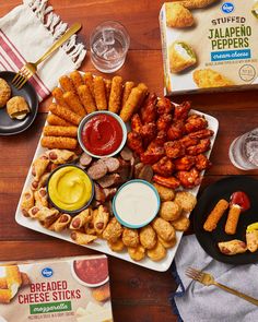 several different types of food on plates and in bowls next to each other, including breaded cheese sticks