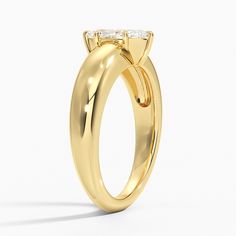 a yellow gold engagement ring with two diamonds