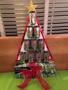 a small christmas tree made out of cans