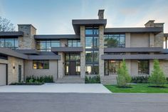 a large house with lots of windows and doors