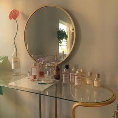 a mirror and some bottles on a table