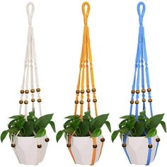 three hanging planters with plants in them and beads attached to the top, each