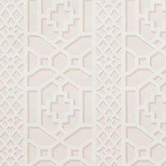 a white wallpaper with an intricate design on the front and back side of it