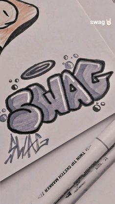 some type of graffiti written on paper with crayons