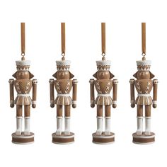 four wooden nutcrackers are lined up in the shape of three different people