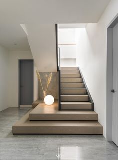 the stairs in this modern house are made of concrete