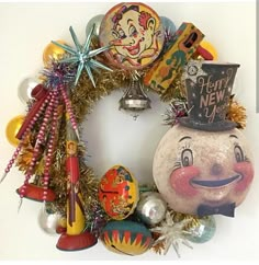 a christmas wreath with clown faces and decorations