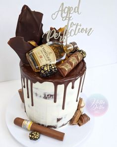 a birthday cake decorated with chocolate and liquor