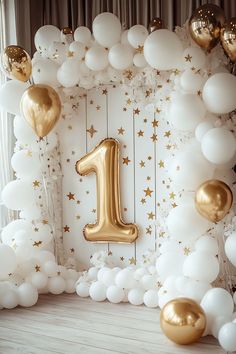 an image of a birthday backdrop with balloons and gold number one on the front wall