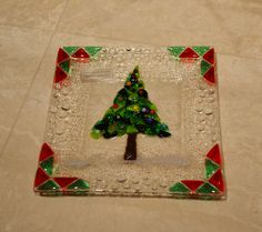 a glass plate with a christmas tree on it