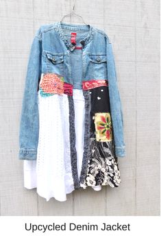 an old jean jacket hanging on a clothes line with other clothing pieces attached to it