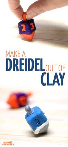 the cover of make a dreidel out of clay, with two small toy cars