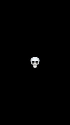 a black background with a white skull in the middle