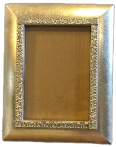 an old gold frame with ornate designs on it